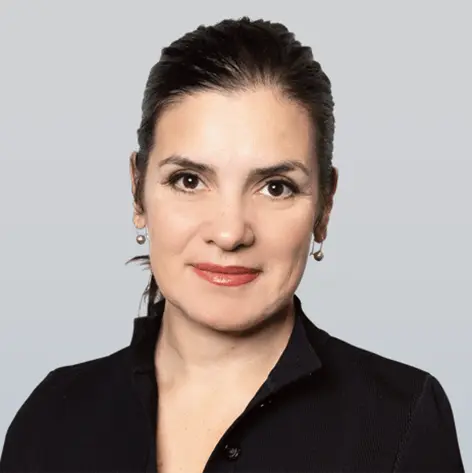 Headshot of Marisa Leone, a professional with long, dark hair, wearing a dark-colored blouse and smiling at the camera.